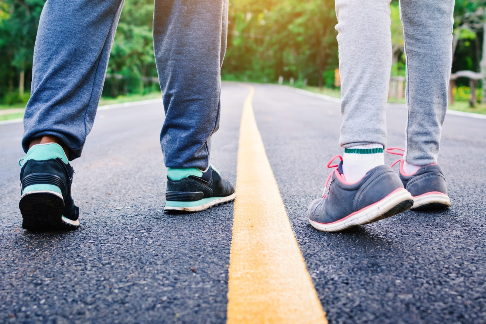 Person walking along a yellow line